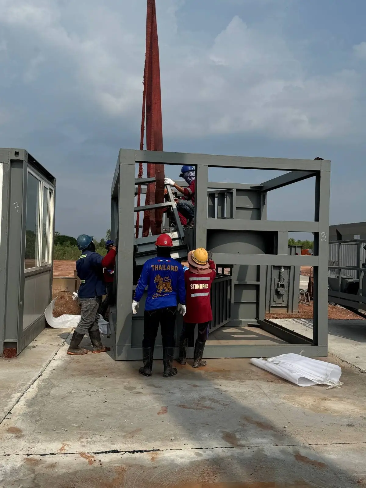 Installation of Shaanxi Roadbest JLB series asphalt mixing plant in Southeast Asia using modular container design.